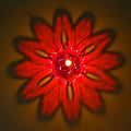 Overhead view of the 12-piece Diwali candle holders in various hues.