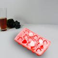 Heart-shaped ice cubes floating in a refreshing drink, adding a lovely touch.