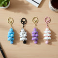 Cute decorative keychain charm showcasing a charming cloud and bell design.