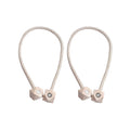 Non-magnetic pearl curtain tiebacks in use, adding a touch of elegance to living room decor.