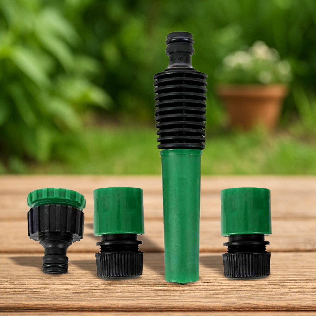 A 4-piece garden hose nozzle connected to a hose for efficient outdoor watering.