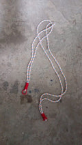 Lifestyle image showing a smartphone easily accessible via its phone lanyard from a bag.