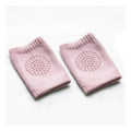 Pair of soft crawling knee pads in grey, designed for toddler comfort and safety.