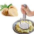 Close-up of the robust stainless steel masher, great for various boiled vegetables and dal.
