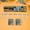 The utensil hanger rail mounted on a kitchen wall, neatly holding various kitchen ladles and tools.