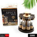 A hand selecting a spice jar from the 360-degree revolving spice rack, showcasing its ease of use.