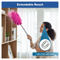 Person using the long reach duster for high ceiling cleaning