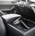 USB rechargeable car vacuum cleaner with charging cable and nozzle attachments.