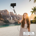 User holding the compact selfie stick for a perfect group photo.
