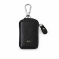 Elegant black PU leather car key case on white background.