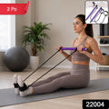 Person demonstrating yoga stretches using the resistance band exercise bar.