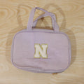 Detailed view of multi-pocket toiletry pouch with compartments