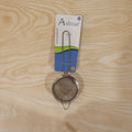 Tea strainer in daily kitchen use over a mug