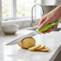 Hand slicing vegetables with 9-inch kitchen knife