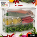 Stackable fridge storage containers holding fresh vegetables and fruits inside a refrigerator.