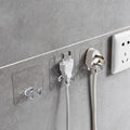 Set of transparent wall storage hooks arranged in a kitchen for efficient organization.