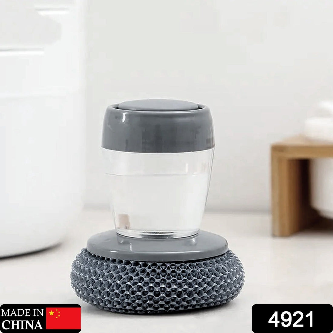 Ergonomic Soap Dispensing Dish Brush with clear soap reservoir for easy refilling.