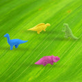 Multiple animal erasers shaped like dinosaurs, showcasing various colours and designs.