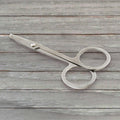 Elegant compact nail clipper set with its clear storage case for easy access.