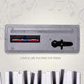 Close-up of the microphone input on the kids piano keyboard.