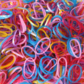 Multicolor rubber bands effectively bundling pencils and electronic cords on a desk.