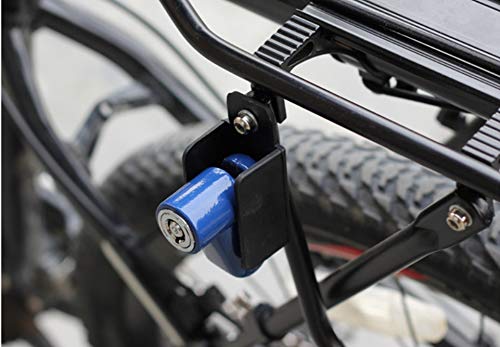 A bright red motorcycle wheel security device with an open shackle and two black keys inserted into the lock cylinder.