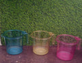 Clear plastic mug, ideal for versatile use.