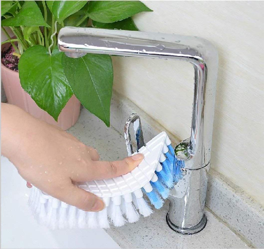 A flexible cleaning brush demonstrating its bendable plastic body for reaching tight spaces.