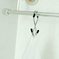 Set of 5 stainless steel S-hooks for home organization.