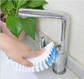Flexible cleaning brush positioned to clean a bathroom faucet.