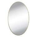 Installation view of an oval mirror wall sticker being applied to a smooth surface.