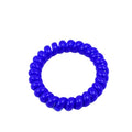 A single blue elastic telephone wire hair tie with its signature coil shape.