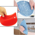 Practical silicone hot mat protecting a wooden surface from a hot serving bowl.