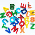 Kids using magnetic letters to form words and learn spelling skills.