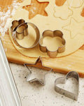 The complete 12-piece stainless steel cookie cutter set displayed with all four shapes and sizes.