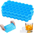 Green flexible silicone ice cube tray with innovative honeycomb pattern.