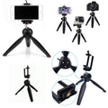 Mini tripod with a smartphone mounted, demonstrating its use as a stable phone stand.