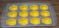 Glass of chilled beverage with delightful fruit-shaped ice cubes and the silicone mold.