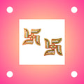 Acrylic Swastik stickers showcasing detailed bead and rhinestone craftsmanship