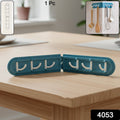 Foldable hook rack installed on kitchen wall holding utensils