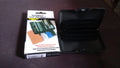 Multiple JourneyMate waterproof card holders neatly stacked, illustrating their compact and uniform design.