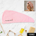 Lightweight microfiber towel wrap securing hair with button closure