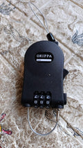 Detailed view of the three-dial combination mechanism on the secure travel lock.