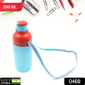 Person holding a 500ml insulated water bottle with its practical dori carry strap.