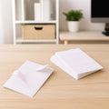 All purpose adhesive white labels neatly stacked and ready for use