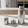 Durable stainless steel baby feeder bottle with soft nipple