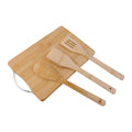 Natural wood board set with bamboo utensils for cooking and prep