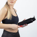 Person drinking from stainless steel sports water bottle with flip-top