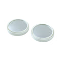 Close-up view of white round car blind spot mirror
