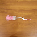 Bottle cleaning brush in use with 360 degree rotary handle